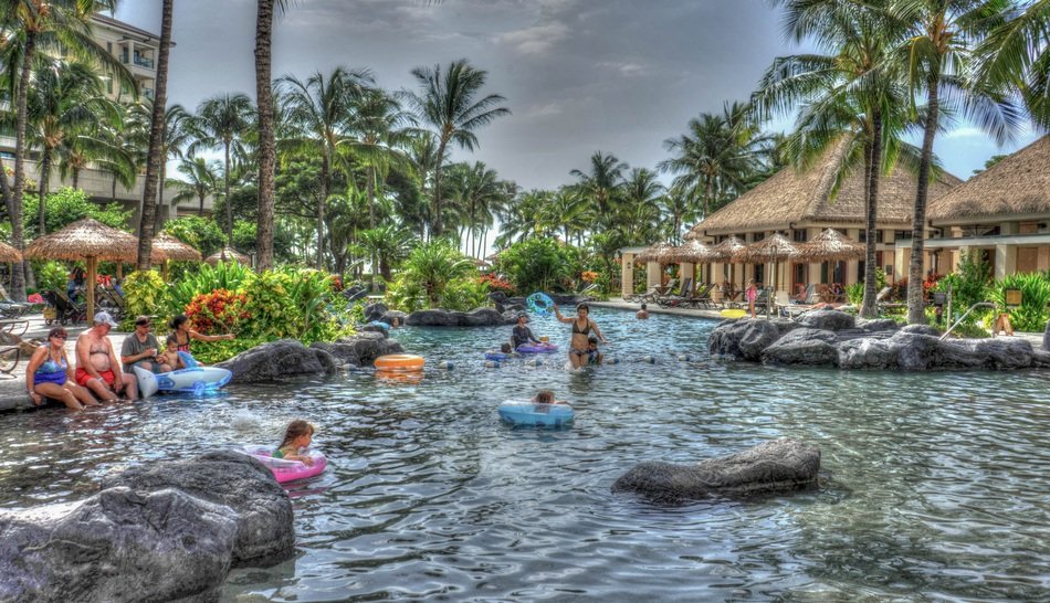 people near the beautiful pool in Hawaii