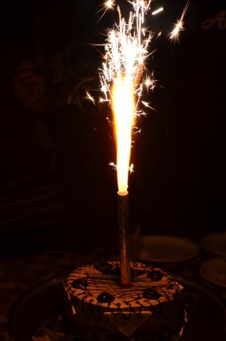 burning candle on the cake