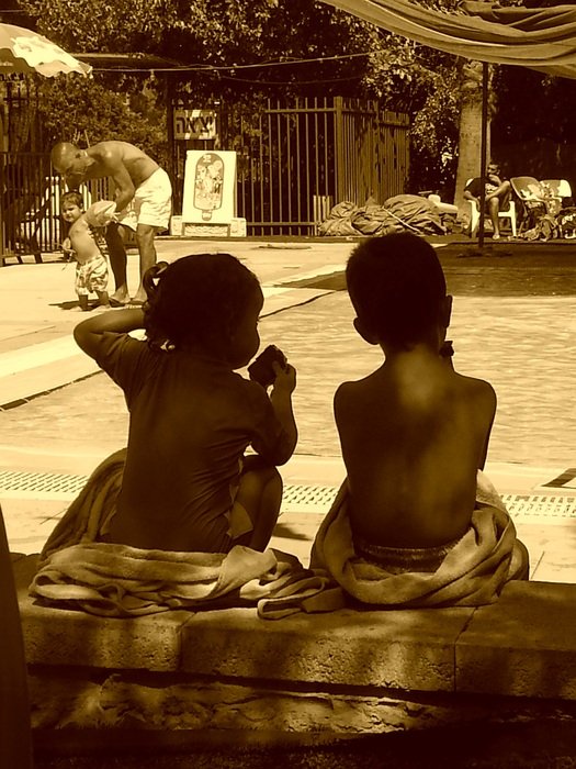 children near the pool in monochrome image