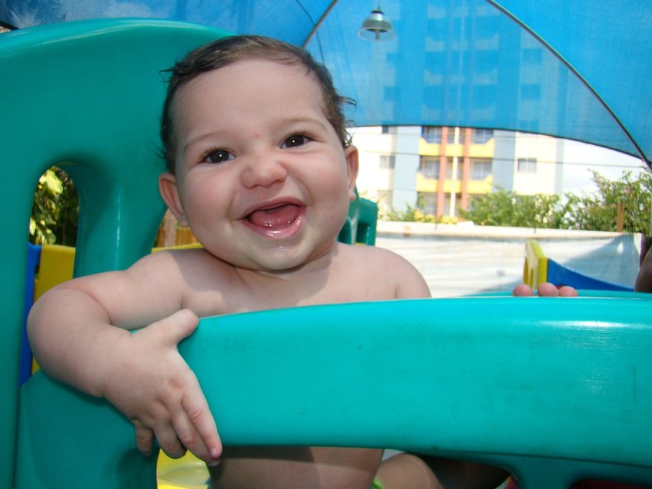 little kid on the playground in the pool