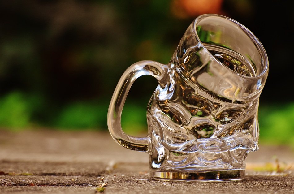 deformed transparent beer glass
