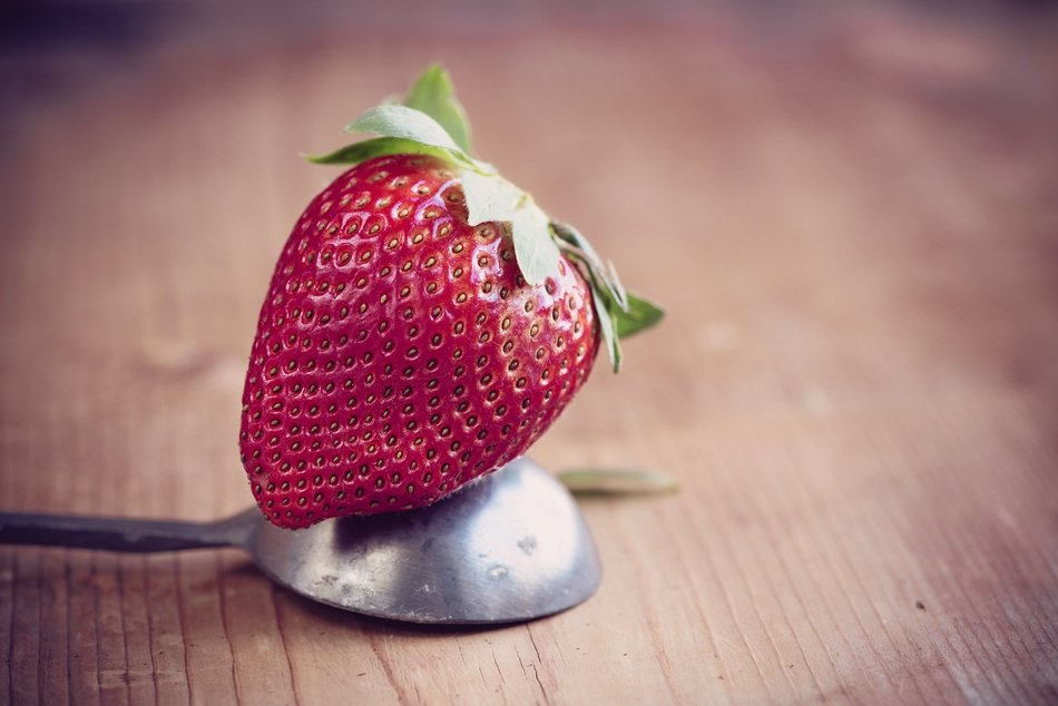 juicy strawberry on the spoon