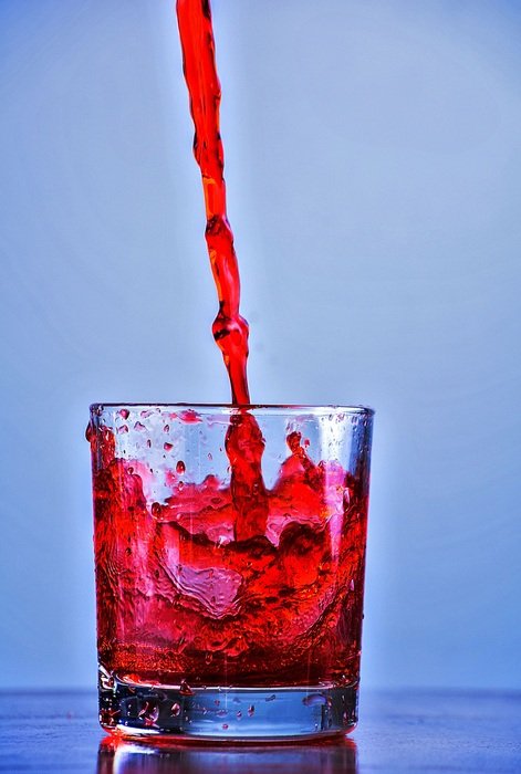 juice pours into the glass