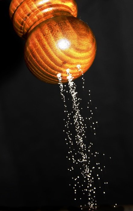 Salt is pouring from the shaker