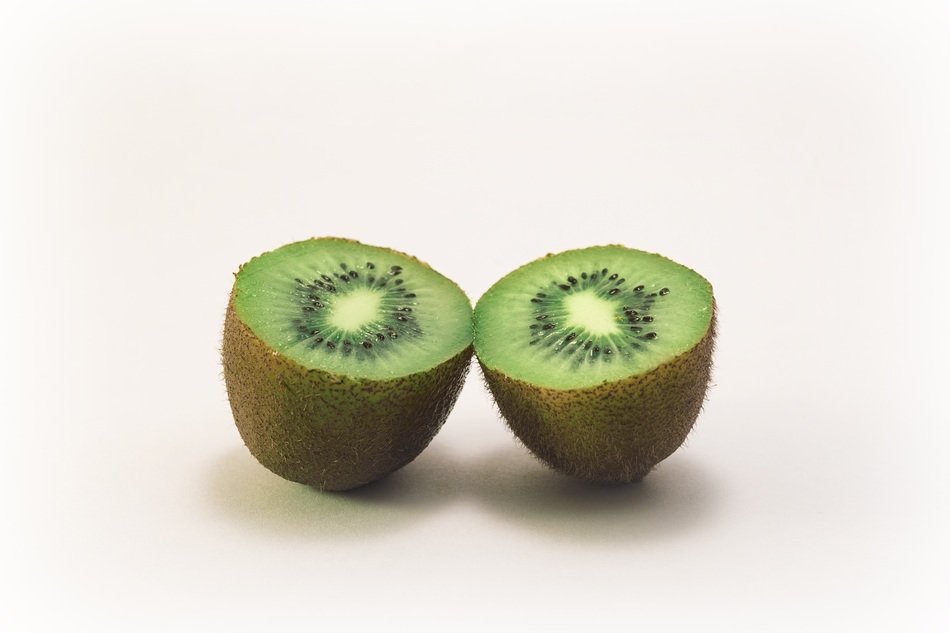 cut Kiwi Fruit, two parts side by side