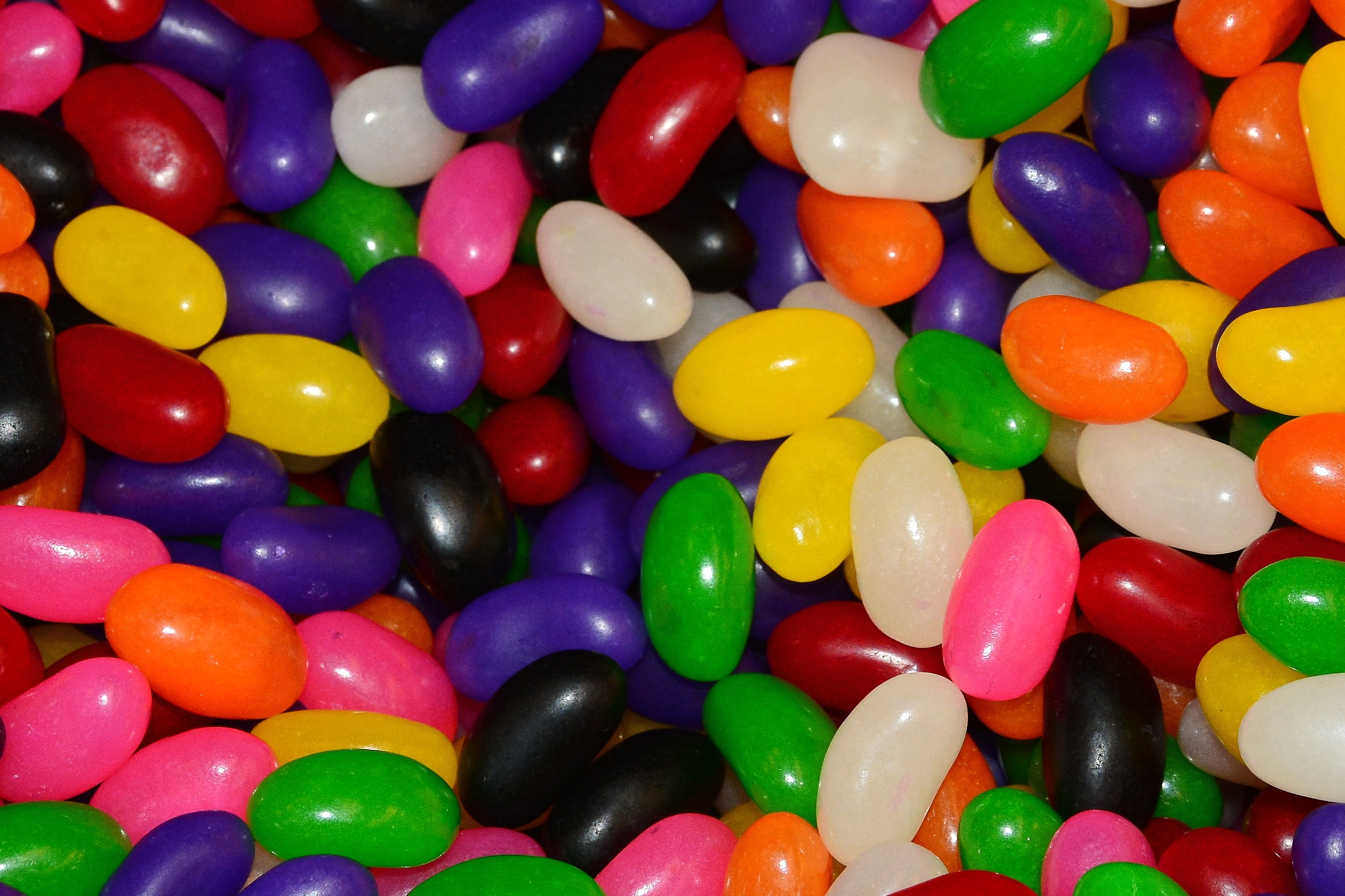 Different colors of the jelly beans with the different tastes free ...