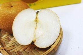 chopped pear in wicker plate