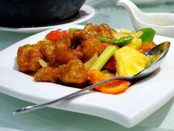 sweet-sour pork on a white plate