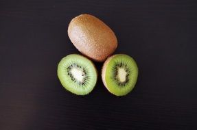 sliced kiwi in the black background