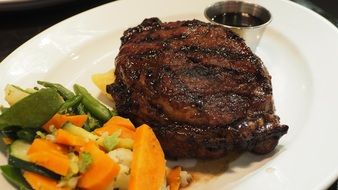Delicious diner made of grilled steak and vegetables