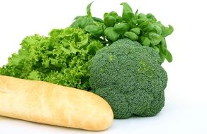 fresh bread and bright greens on white background