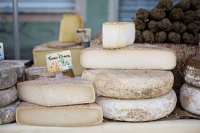 a stack of cheeses on the counter