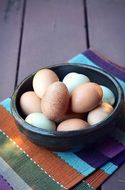 boiled eggs in a black bowl