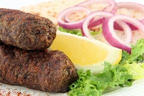 kebab with onion, lemon and herbs