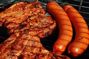 meat and sausages on the barbecue