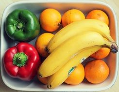 sweet pepper with fruit in a white plate