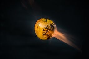 yellow apple on fire