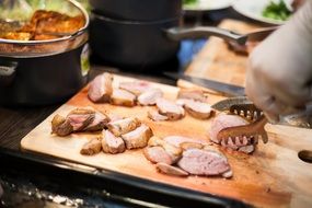 cooking duck meat close-up on blurred background