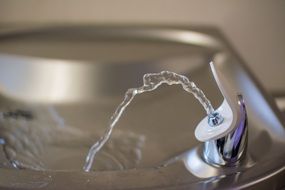 photo of a fountain for drinking close-up on blurred background