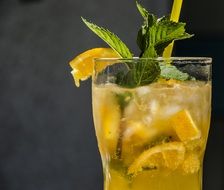 refreshing drink in a glass on a black background