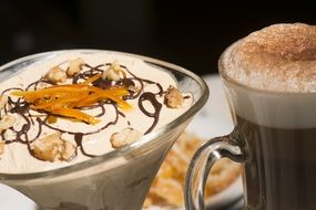 cup of coffee next to the dessert