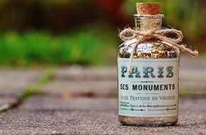 vintage glass bottle with cork and paris label