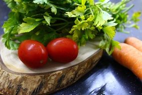 tomatoes with herbs on a cutting board