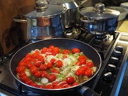 pan with tomatoes and leek
