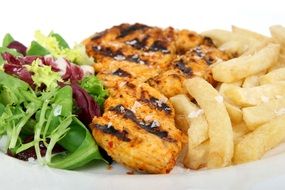 french fries with meat and salad