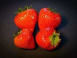 four fresh strawberries