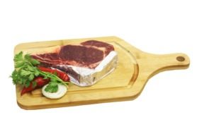 meat with vegetables on a wooden board