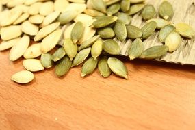 A lot of healthy raw uncooked pumpkin seeds