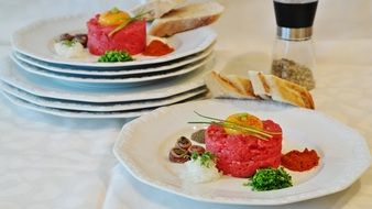 meat tartare on white plates