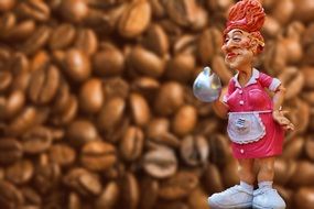 Coffee and ceramic figurine waitress