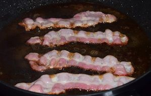 fried bacon in a pan