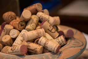 variety of wine corks in a bowl