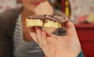 bread with chocolate in hand