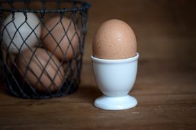 Brown and white hens Eggs Basket