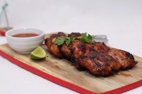fried chicken with chili sauce and lime