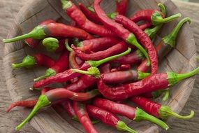 red chili peppers on wicker plate