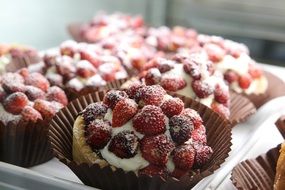 cupcakes with whipped cream and berries