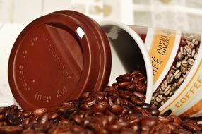 coffee to go mug and coffee beans