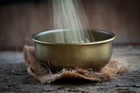 Wheat in a brass bowl