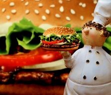 ceramic figure of chef with burger