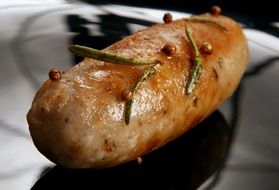 closeup photo of grilled sausage with rosemary