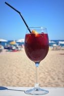 sangria in a glass on the beach