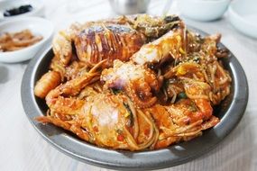 seafood and pasta in bowl on table