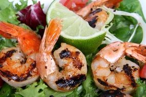 Asian Barbecue prawns with lime slice close-up