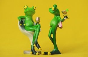 relaxing two ceramic frogs