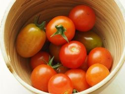 unripe tomatoes in a deep bowl